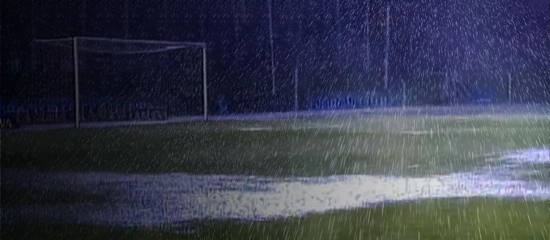 Chris standing up holding his daughter Elva